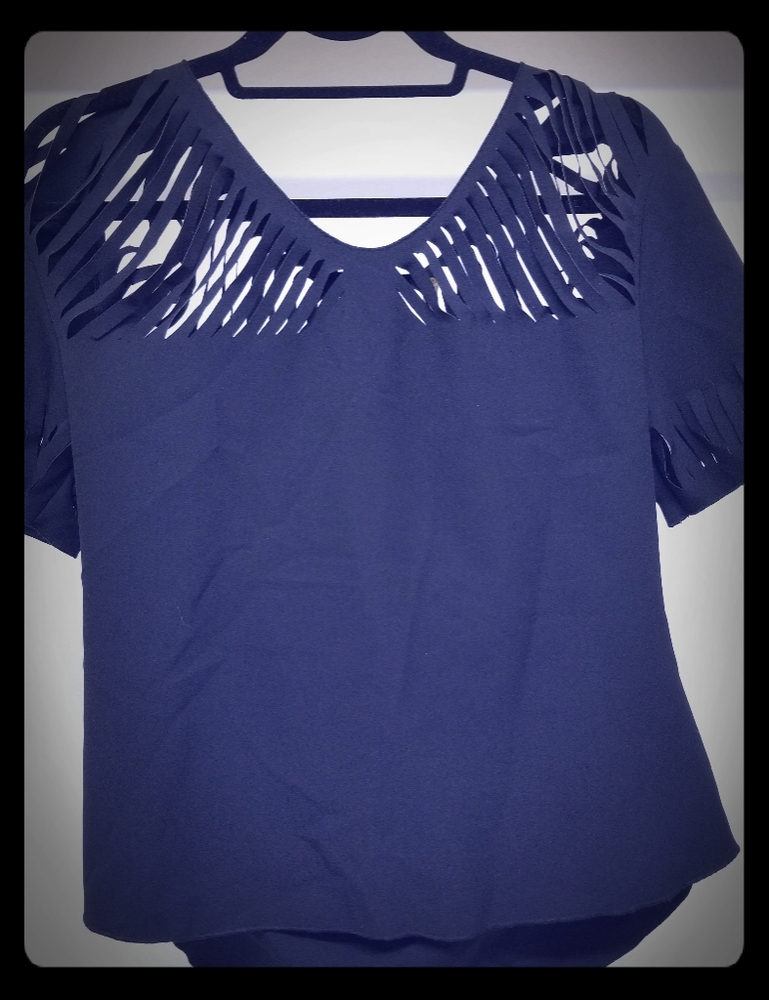 Exetera Boutique laser cutout blouse